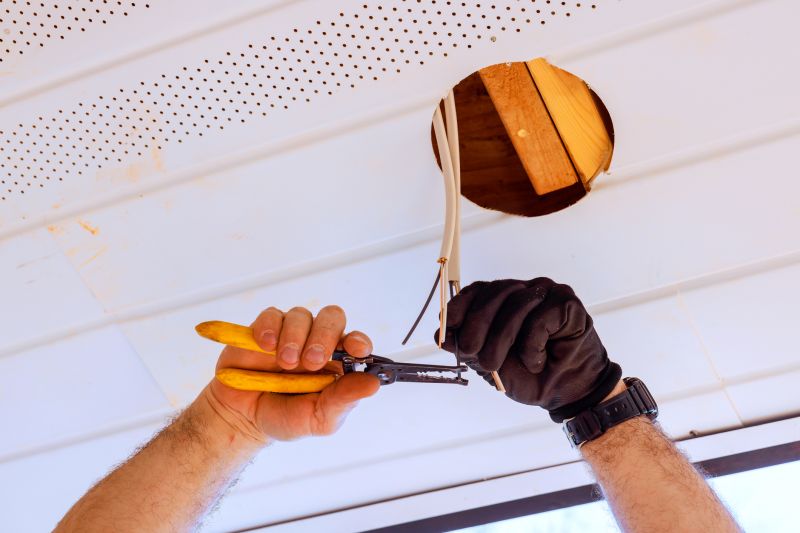 Handyman Installing a Light Fixture